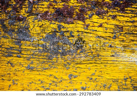 Painted Old Wooden Yellow Wall with sand on it. Background