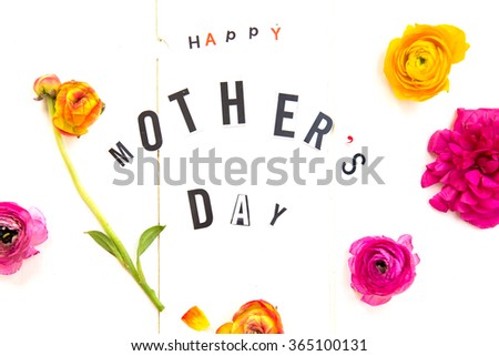 Happy Mothers Day Letters cut out from the Magazines and Flowers Ranunculus. Isolated