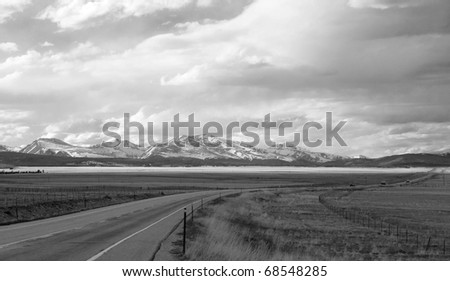 Black and white view of wide open spaces near Kenosha Pass, Colorado, on a day of dramatic weather.