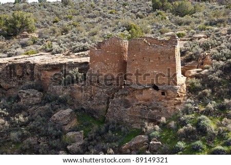 Old round tower and square tower next to each other in Hovenweep National Monument in Utah.