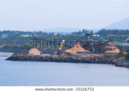 Piles of wood chips at pulp mill
