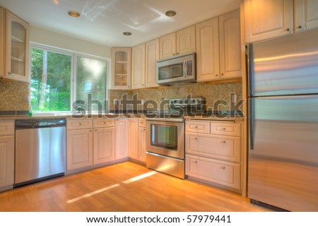 Contemporary kitchen with stainless steel appliances and granite counters