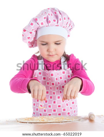 stock photo Little girl in pink apron spreading cheese on pizza crust