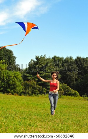 Young woman  flying a kite