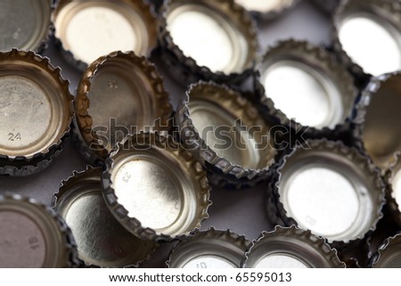 Beer bottle caps in a pile