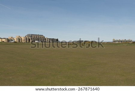 A view of the Old course St andrews with the Old course hotel and links cafe in the distance