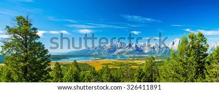 Grand Teton National Park, Wyoming.  Grand Tetons Mountain Range. Blue Sky.  Panorama