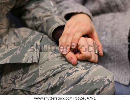 Military couple holding hands, married caucasian, Air Force.