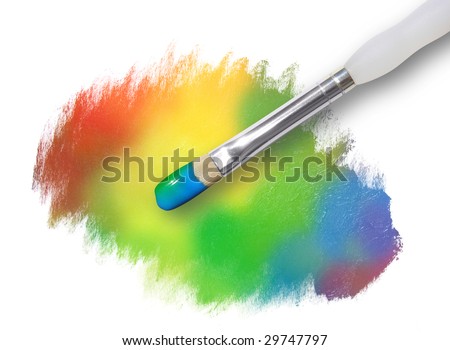 A paintbrush is painting a rainbow palette spot. The paint splatter has rough edges.