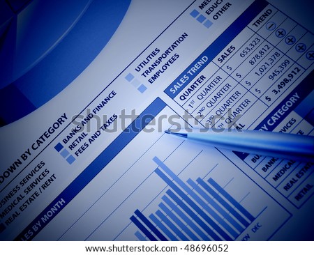 A closeup of a business financial chart with bar and pie graphs. A pen is on top. Can be used to represent business expenses, growth or revenue. There is a blue color to it.