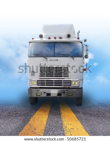A shipping truck is on a road with the sky fading in the background. Can be used as a transportation, cargo or travel image for business and shipping goods.