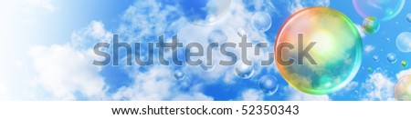 A big rainbow colored bubble is floating in the sky with smaller bubbles in the background. There are clouds and copyspace area for your text as a header graphic.