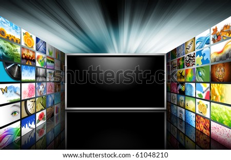 A flat screen television has a blank black text area with photo images coming out of the sides of it. The tv has a glowing light coming out the top. Use it for a media technology concept.
