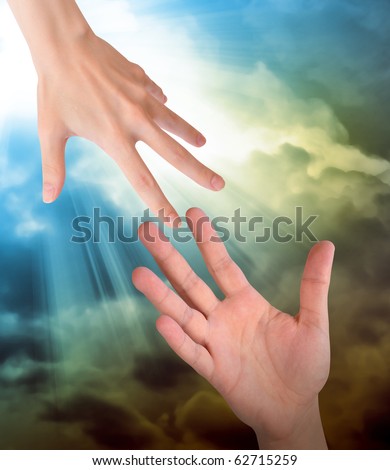 A hand is reaching out or grabbing for help from another hand in the sky. Clouds are in the sky as the background. Use it for a safety, religious or support concept.