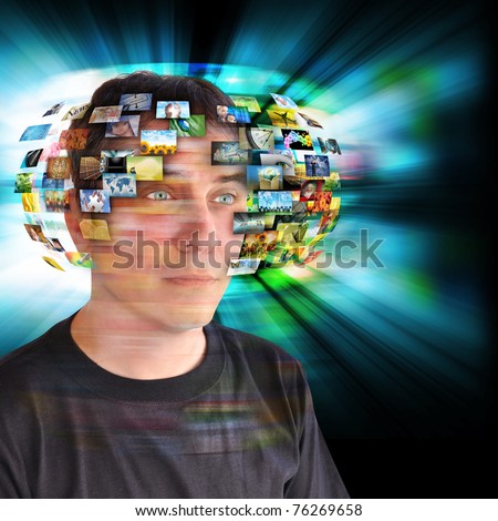 A technology man has images around his head with an abstract glow. Use it for a communication or tv concept.