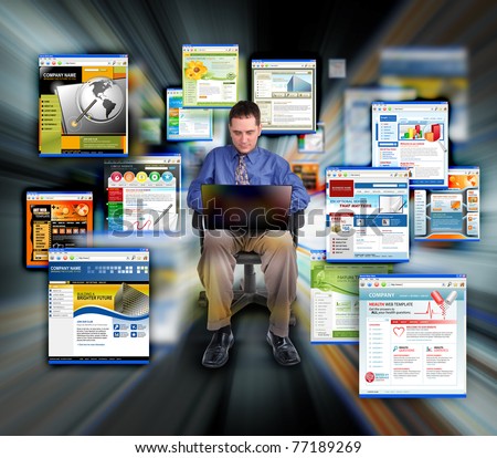 A business man is sitting on a black background and is working on a laptop computer. He is browsing websites that are zooming for speed.