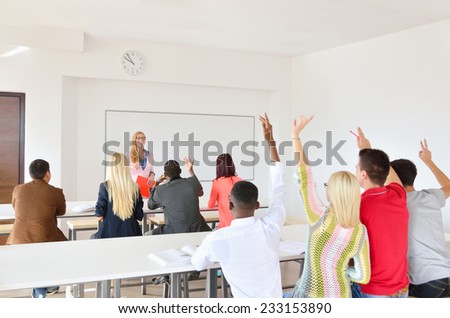 Professor examines a group of young students, black, white, Chinese and girls, hands up