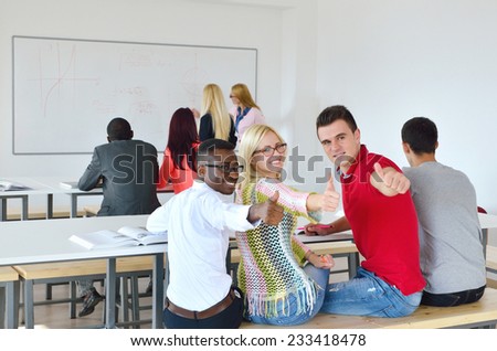 Professor shows a group of young students, black, white, Chinese and girls in lectures, finger up