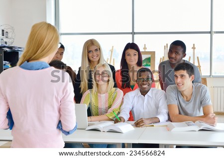 Professor examines a group of young students, black, white, Chinese and girls,