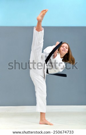 young, beautiful and successful woman karate, kick attack