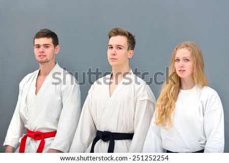 young, beautiful and successful karate woman and man in karate position