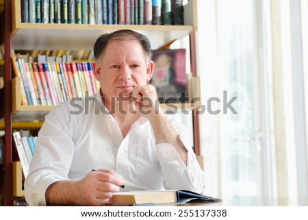 Portrait of a writer in the signing of books and thinking about the inspiration romance novel