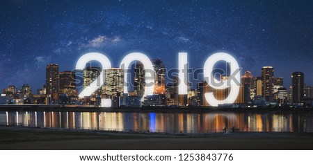 New Year 2019 in the city. Panoramic city at night with starry sky and happy new year 2019 celebration
