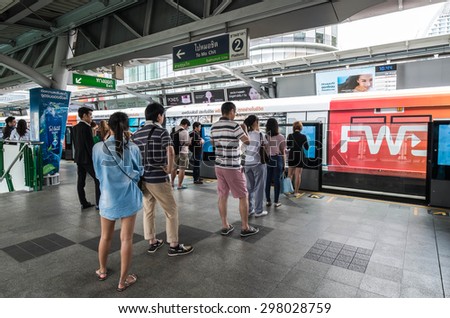 BANGKOK THAILAND - JULY 18 - People standing in lines waiting for BTS sky train at Asoke station on July 18, 2015 in Bangkok Thailand