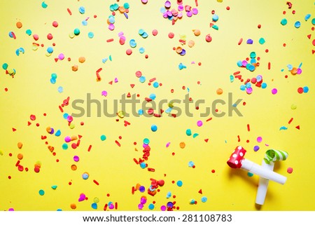 confetti on yellow background