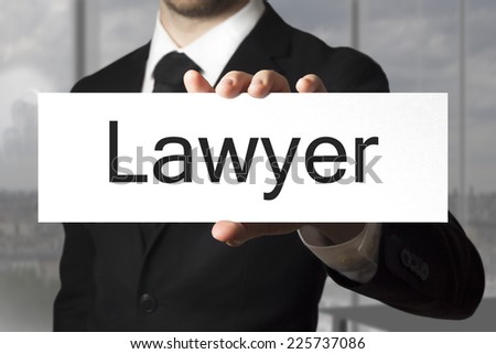 businessman in black suit holding sign lawyer