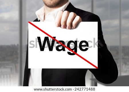 businessman in black suit holding sign wage crossed out