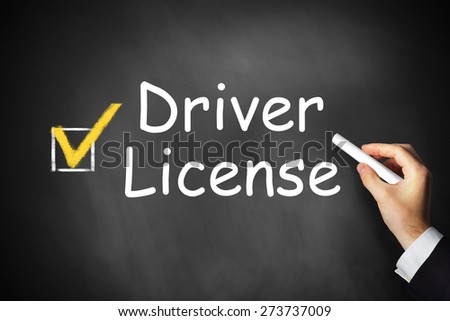 hand writing driver license on black chalkboard checkbox completed
