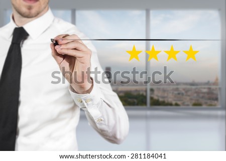 businessman in office pushing flat button four golden rating stars