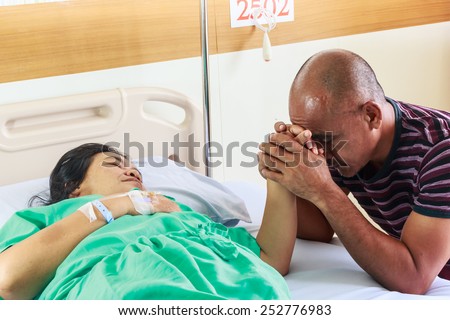 Husband pray for his wife recover from illness.