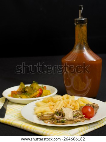Pasta with chinese pig ears garlic soy salad, bottle of red hot chili pepper sauce and preserved paprika snack