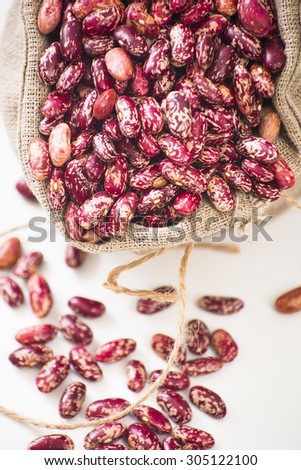 flax bag of red and white bean seeds