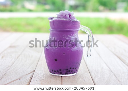 taro milk tea  smoothie on a wooden table
