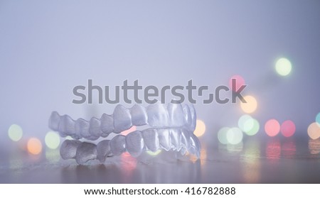 Invisible braces on gray background and bright colors