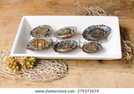 Limpets are marine mollusk with a conical shell, which adhere strongly to the rocks. They are a typical snack of the Canary Islands.