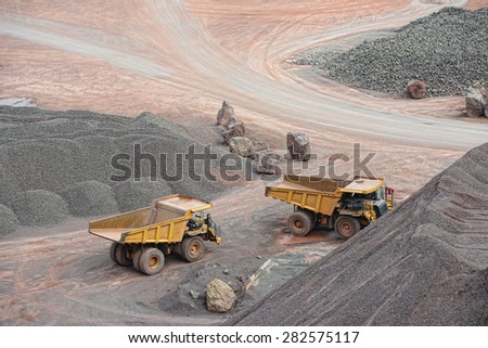 dumper trucks parking in a surface mine.