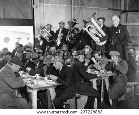 Municipal Lodging House Thanksgiving dinner The hungry and destitute of New York City eat their free thanksgiving dinner accompanied by a brass band Nov.