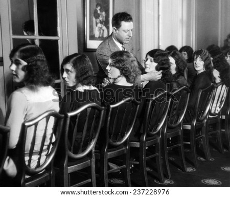 JR Hirschfield of Detroit choosing models for American Styles Creation Contest Aug. 30, 1927.