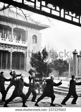 Middle-aged Chinese men practice T\'ai chi in Hopei Province Communist China Jan.