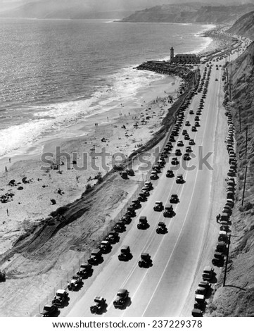 Start of the beach season Thousands of cars drive on Roosevelt highway north from Santa Monica Many are parked along the base of the mountains on the scenic Malibu coast.
