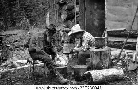 The Gold Rush, miners with gold in a pan, photograph by F,W, Byerly.