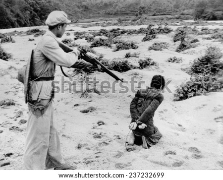 Execution after a \'people\'s tribunal\' in the land reform movement in Communist China Huang, probably a landowner paid for his \'crime\' by being shot. Jan, 1953.