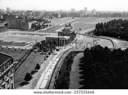 Aerial view of Brandenburg Gate where the Berlin Wall forms a loop East Berlin stretches into the distance.