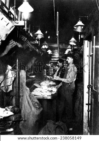 Sorting the mail in a railway post office on a mail train 1930s