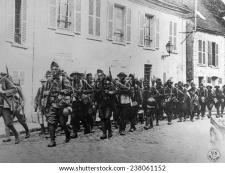 World War I, American troops of the 166th Infantry, 42nd Division, entering La Ferte-sous-Jouarre, France, U.S. Signal Corps photograph, 1918.