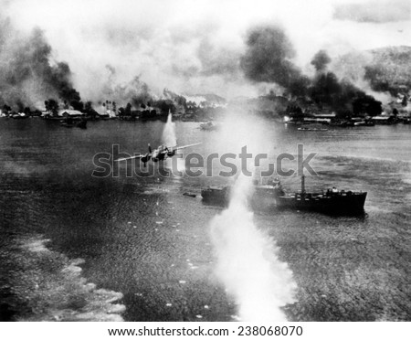 At the Harbor of Rabayl a bombing of a Japanese ship (in foreground) The white plulme in the center foreground is a waterspout from bomb burst outside the focus of the camera